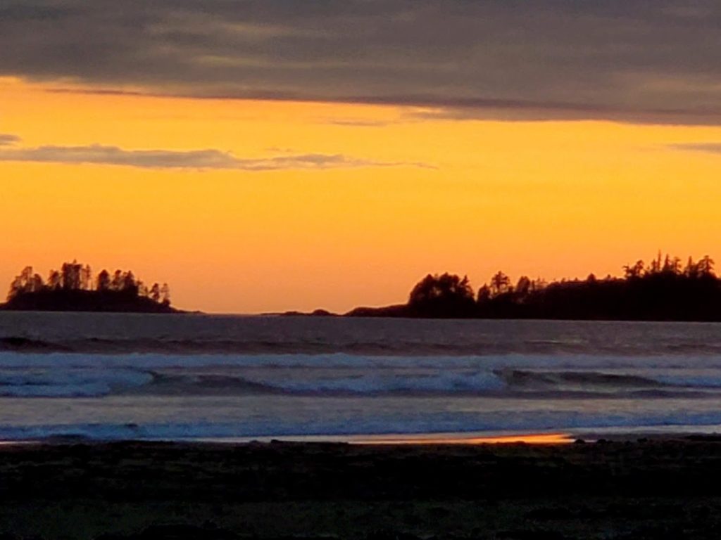 Sunset picture of waves rolling on the beach. Picture was taken on Green Point campground, Pacific Rim National Park.